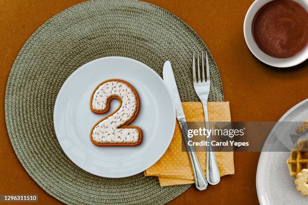 number 2 cookie in a plate - 3d number 2 stock pictures, royalty-free photos & images