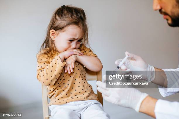 vaccination to a child - vaccine fear stock pictures, royalty-free photos & images