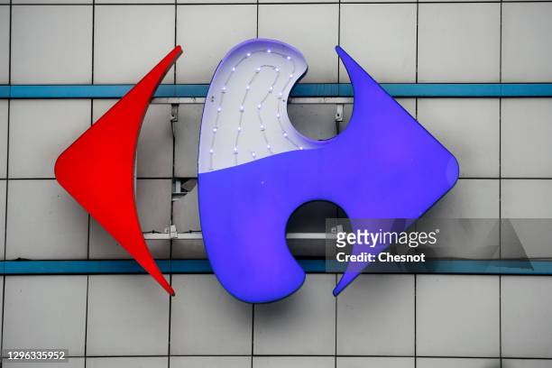 Broken Carrefour logo sits on the facade of a Carrefour supermarket on January 14, 2021 in Paris, France. The Canadian distributor Couche-Tard, a...