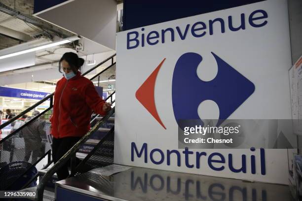 Carrefour logo sits on inside a Carrefour supermarket on January 14, 2021 in Paris, France. The Canadian distributor Couche-Tard, a specialist in...
