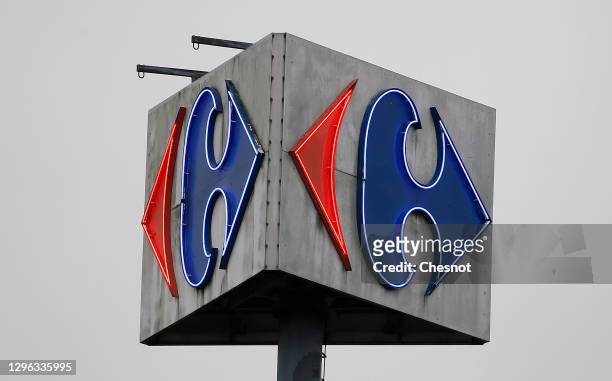Carrefour logo sits on the facade of a Carrefour supermarket on January 14, 2021 in Paris, France. The Canadian distributor Couche-Tard, a specialist...