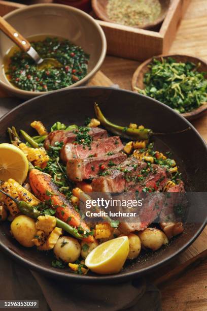 argentinian grilled steak with roasted root vegetables - argentinian culture stock pictures, royalty-free photos & images