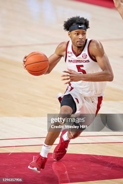 Moses Moody of the Arkansas Razorbacks drives to the basket during a game against the Georgia Bulldogs at Bud Walton Arena on January 09, 2021 in...