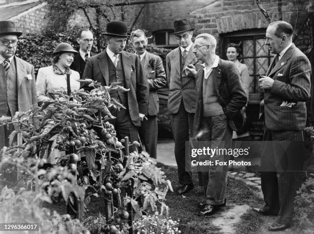 Bernard Fitzalan-Howard, 16th Duke of Norfolk and Parliamentary Secretary to the Ministry of Agriculture and Fisheries on a visit to inspect gardens...