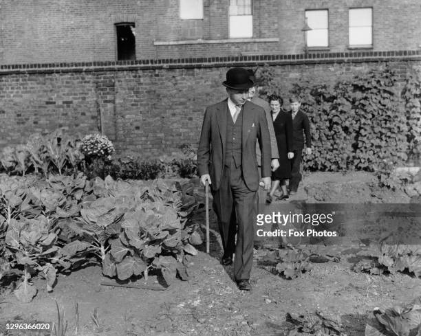 Bernard Fitzalan-Howard, 16th Duke of Norfolk and Parliamentary Secretary to the Ministry of Agriculture and Fisheries on a visit to inspect gardens...