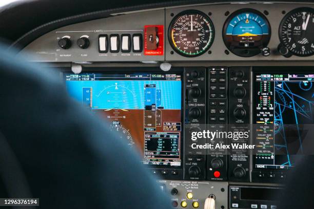 pilot in cockpit of small private aircraft - split flap display stock pictures, royalty-free photos & images