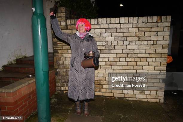 Resident on a street in Saltburn takes part in the Clap for Heroes event on January 14, 2021 in Saltburn-by-the-Sea, England. During the first...