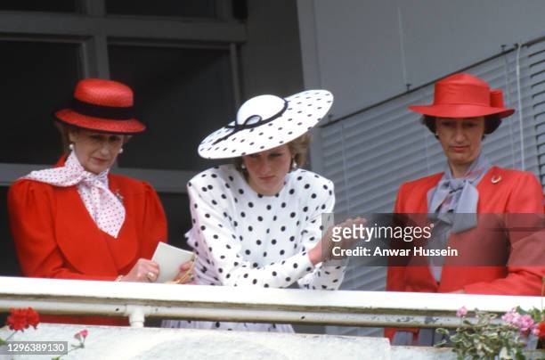 Diana, Princess of Wales , wearing a dress by Victor Edelstein and hat by Frederick Fox, Princess Alexandra and Lady Susan Hussey , stand in the...