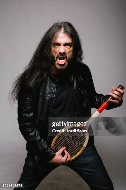 long hair adult man with a tennis racket - hairy back man stock pictures, royalty-free photos & images
