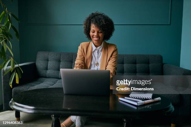 i've got everything i need for a productive day - woman in black suit stock pictures, royalty-free photos & images