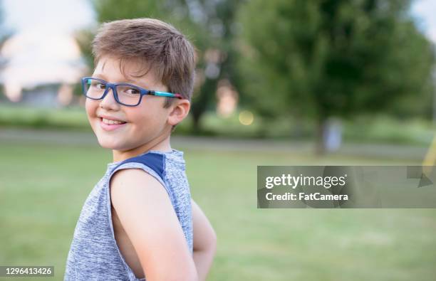 elementary school boy wearing glasses - summer school stock pictures, royalty-free photos & images