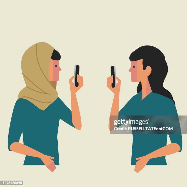 ilustrações de stock, clip art, desenhos animados e ícones de women with and without head scarves taking photo’s on their smart phones - hijab
