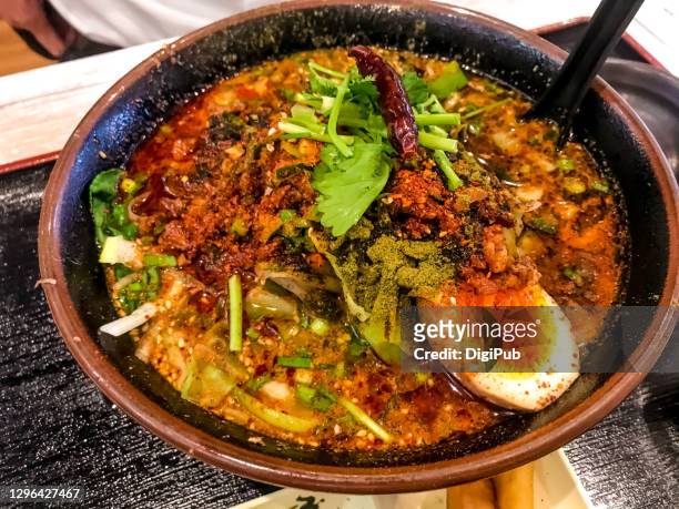 chili hot and tongue numbing daoxiaomian noodles - chuka stock pictures, royalty-free photos & images