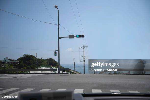 the crossroads of town in okinawa japan. - road signal stock pictures, royalty-free photos & images