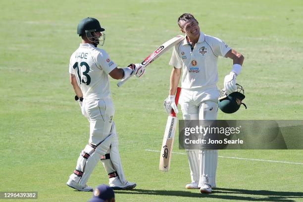 Marnus Labuschagne of Australia celebrates scoring a century with team mate Matthew Wade of Australia during day one of the 4th Test Match in the...