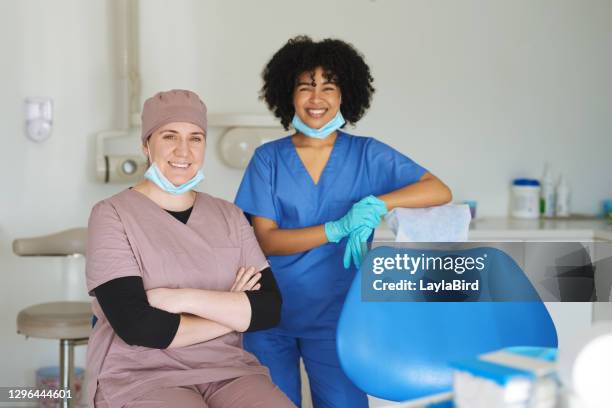 our dental care will make you smile - dental hygienist stock pictures, royalty-free photos & images