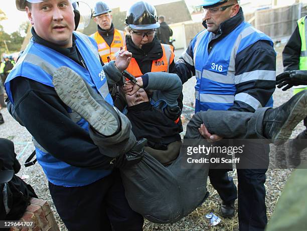 Bailiffs detain a protester during the eviction of Dale Farm travellers camp on October 19, 2011 near Basildon, England. Travellers have fought for...