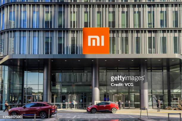 The Xiaomi logo hangs on its headquarters building on January 15, 2021 in Shanghai, China.