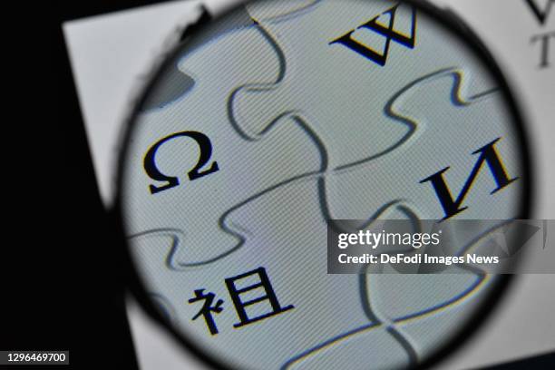 In this photo illustration, The logo of Wikipedia is seen on the screen of a laptop with a magnifying glass on January 15, 2021 in Ankara, Turkey.