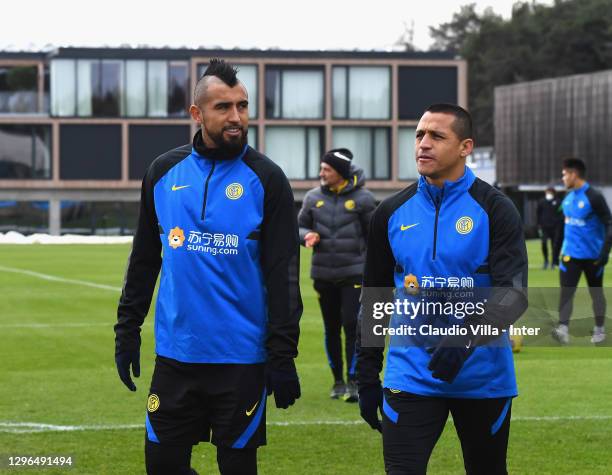 Alexis Sanchez and Arturo Vidal attend an FC Internazionale training session at Appiano Gentile on January 15, 2021 in Como, Italy.