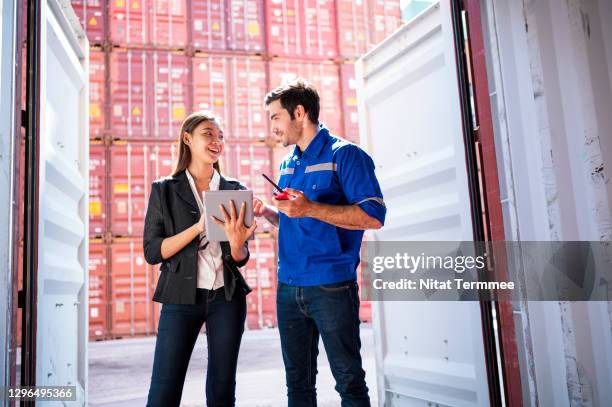import and export customs clearance process. customs officer having discussion some product inside of cargo containers.  logistic and transportation, global business concepts. - customs agent stock pictures, royalty-free photos & images