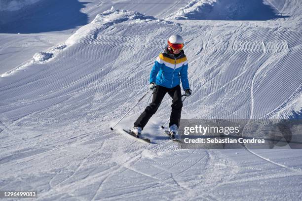 beatifull slope in the alps,  woman having fun while skiing. - woman on ski lift stock pictures, royalty-free photos & images