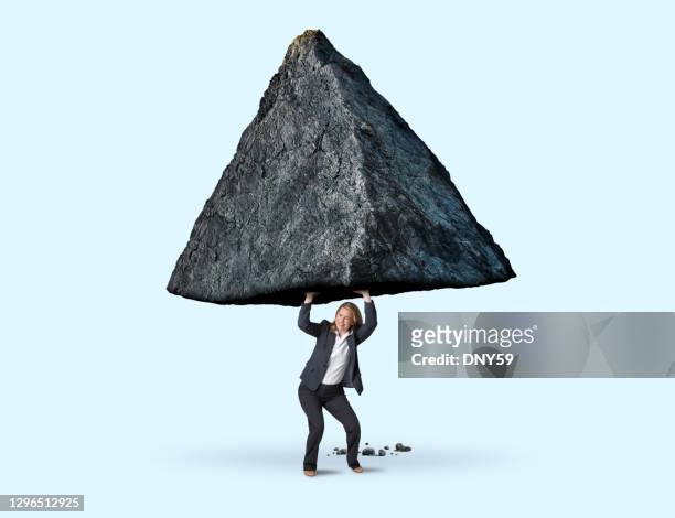 woman trying to move mountains - minirock stock pictures, royalty-free photos & images