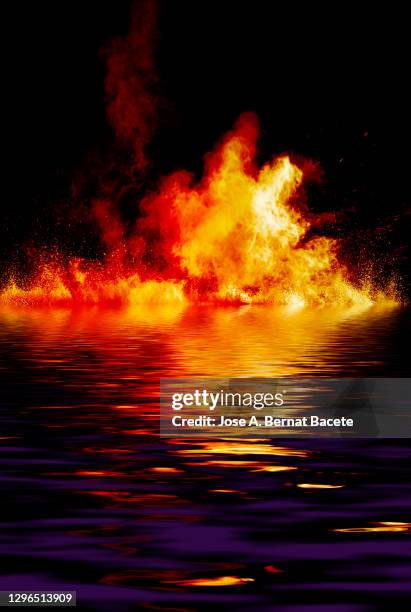 explosion by impact of smoke and fire on a water surface. - flammable 個照片及圖片檔