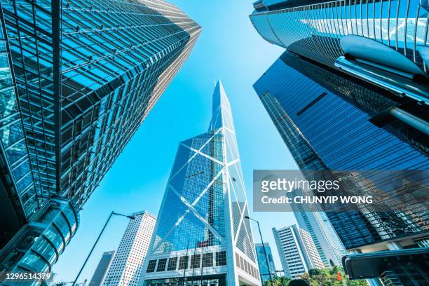 modern skyline with business skyscrapers - hongkong stock pictures, royalty-free photos & images