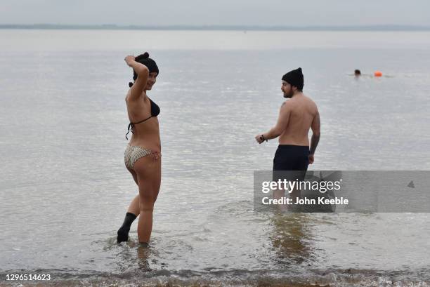 Swimmers, Neave and Joe exercise with a cold water swim at Chalkwell Beach on January 15, 2021 in Southend, England. With a surge of covid-19 cases...