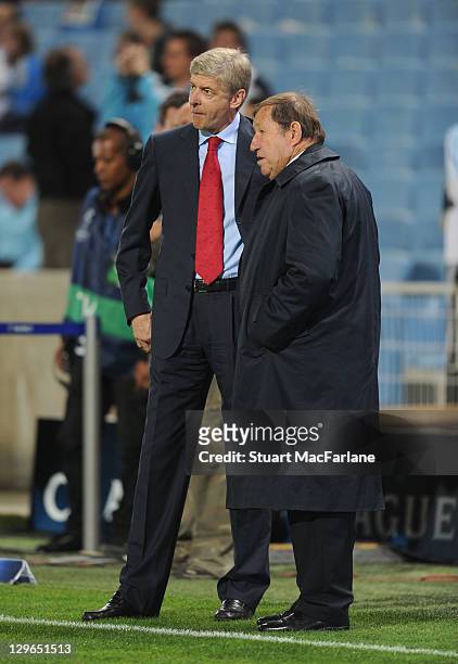 Arsenal manager Arsene Wenger chats with former Auxerre manager Guy Roux before the UEFA Champions League Group F match between Olympique de...