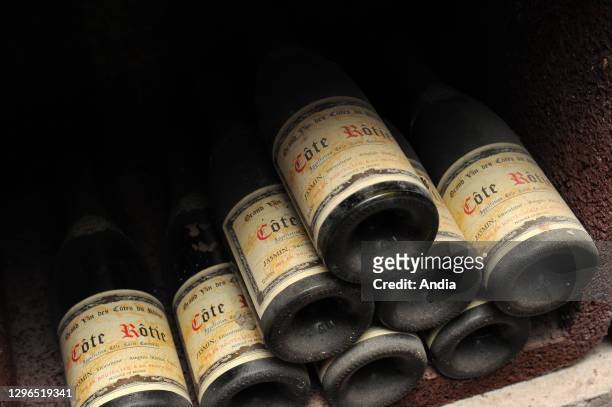 Ampuis : cellar of the wine estate Domaine Jasmin. Bottles of Cote-Rotie wine.