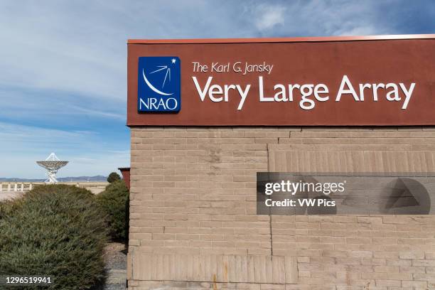 Visitor center and antenna dishes of the Karl G. Jansky Very Large Array radiotelescope astronomy observatory near Magdalena, New Mexico in the...