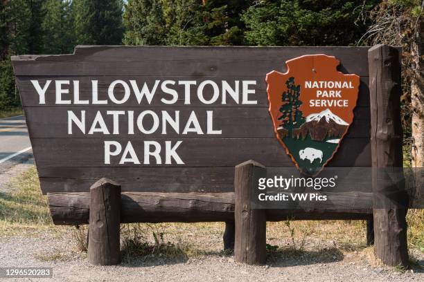 The wooden entrance sign to Yellowstone National Park, USA..