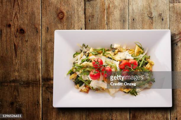 spinach and ricotta penne pasta - white cheese stock pictures, royalty-free photos & images