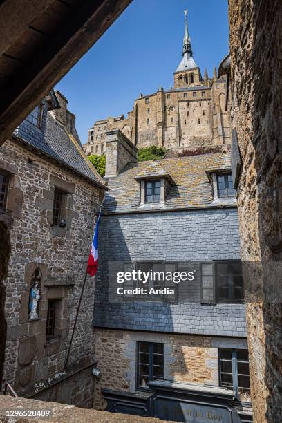 Le Mont Saint-Michel , in Normandy, north-western France: atmosphere in the main street viewed from the empty stairs “escalier des Monteux” during...