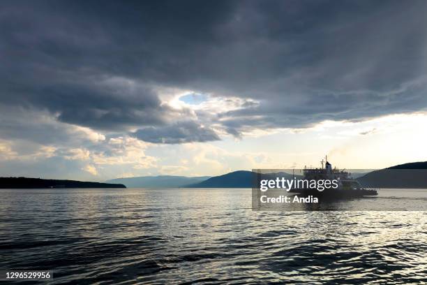 Boat crossing the St. Lawrence river to reach the island “L'Isle-aux-Coudres”, Quebec, Canada. Ferry boat, ferryboat.