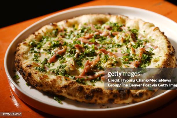 Photo taken Margherita Pizza at Brix Pizza & Wine in Denver, Colorado on Thursday. January 14, 2021. Brasserie Brixton opened during the pandemic and...