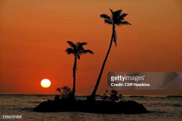 The sun rises over the ocean as seen from the media center during the second round of the Sony Open in Hawaii at the Waialae Country Club on January...