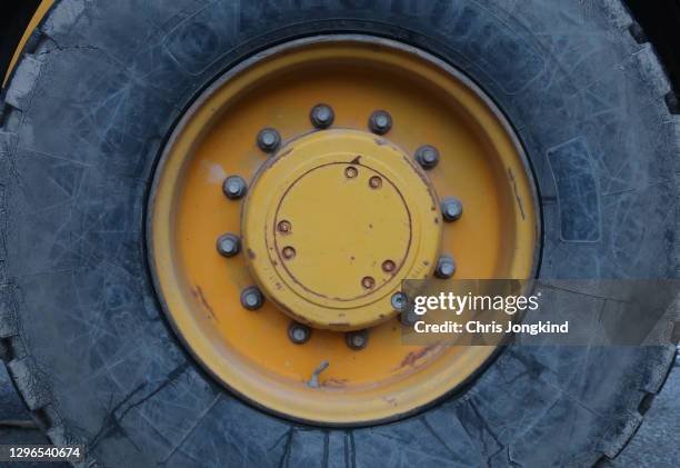 large tire on construction machinery - giant wheel stock pictures, royalty-free photos & images