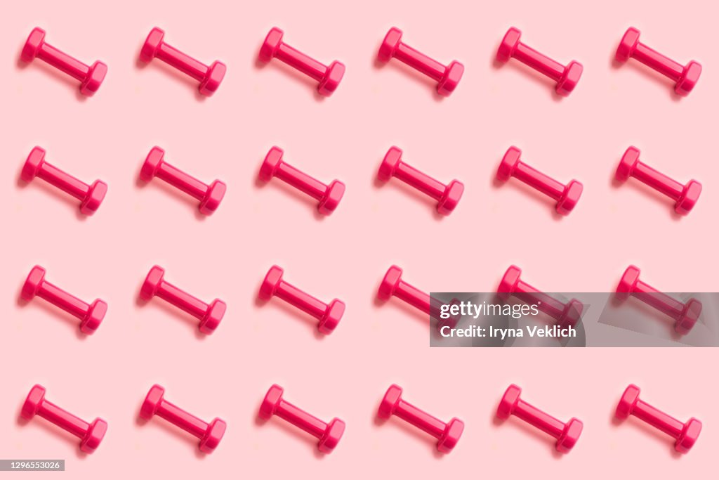 Sport lifestyle concept with pattern with pink dumbbells.