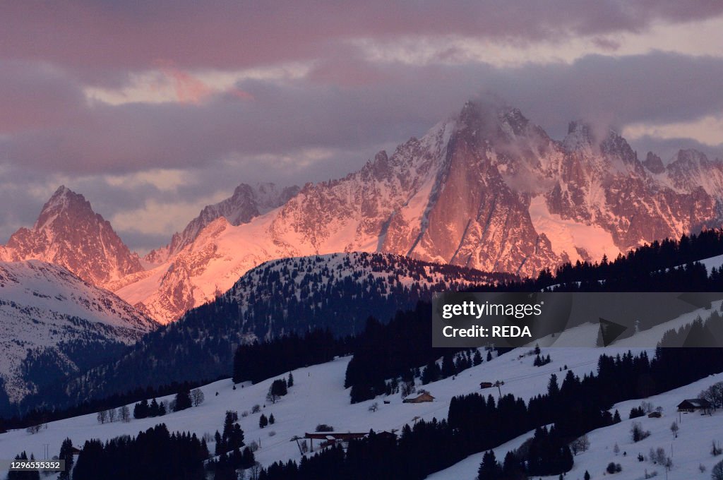 View at dusk on the town of Megeve and the Mont Blanc group. Megeve. Haute-Savoie. France.