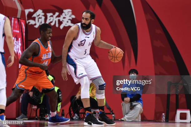 Hamed Haddadi of Sichuan Blue Whales drives the ball against Andrew Nicholson of Fujian Sturgeons during 2020/2021 Chinese Basketball Association...