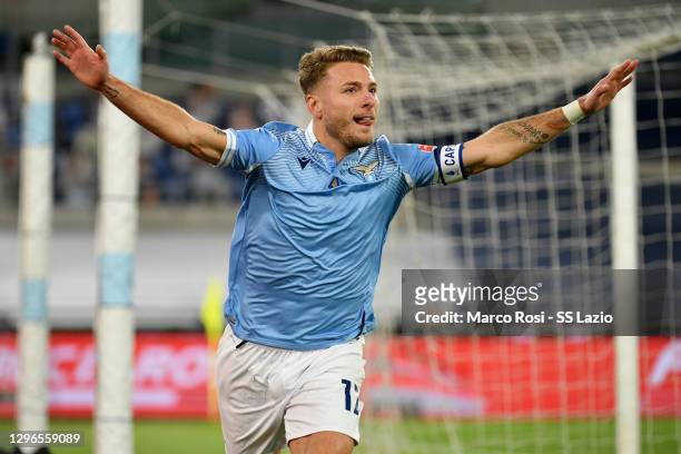 Ciro Immobile of SS Lazio celebrates the opening goal during the Serie A match between SS Lazio and AS Roma at Stadio Olimpico on January 15, 2021 in...
