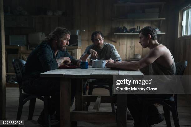 From left, American actor Kurt Sutter, Spanish actor Oscar Jaenada, and English actor Tom Holland in a scene from the film 'Chaos Walking' , Quebec,...