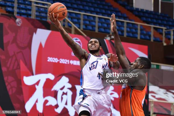 Marcus Georges-Hunt of Sichuan Blue Whales goes to the basket against Andrew Nicholson of Fujian Sturgeons during 2020/2021 Chinese Basketball...