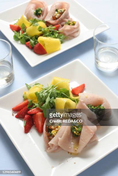 Pickled swordfish with Rucola salad and mango. Italy.