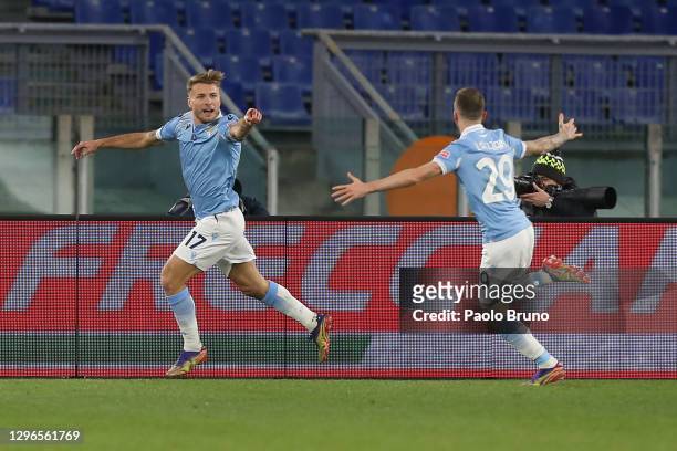 Ciro Immobile of Lazio celebrates with Manuel Lazzari of Lazio after opening the scoring during the Serie A match between SS Lazio and AS Roma at...