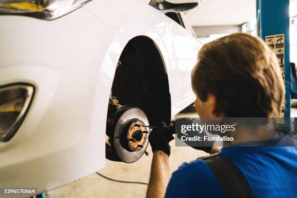 old worn brake discs on a passenger car - brake disc stock pictures, royalty-free photos & images