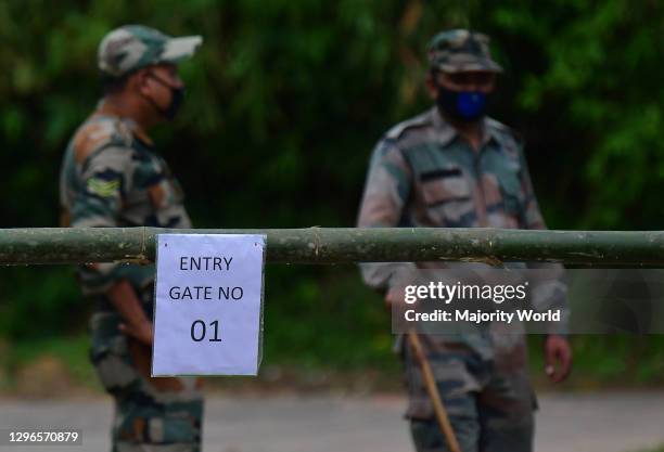 The TSR personal are patrolling the area in front of a temporary gate at a containment zone, to prevent the spread of Coronavirus on the outskirts of...